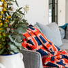 Marli Cotton Slub Throw in Burnt Orange and Navy