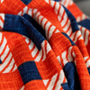 Marli Cotton Slub Throw in Burnt Orange and Navy